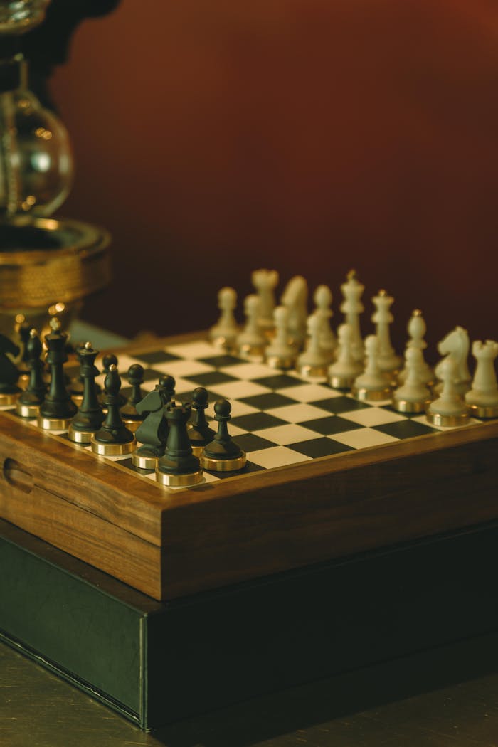 A beautifully crafted wooden chess set displayed in warm lighting, showcasing strategy and elegance.